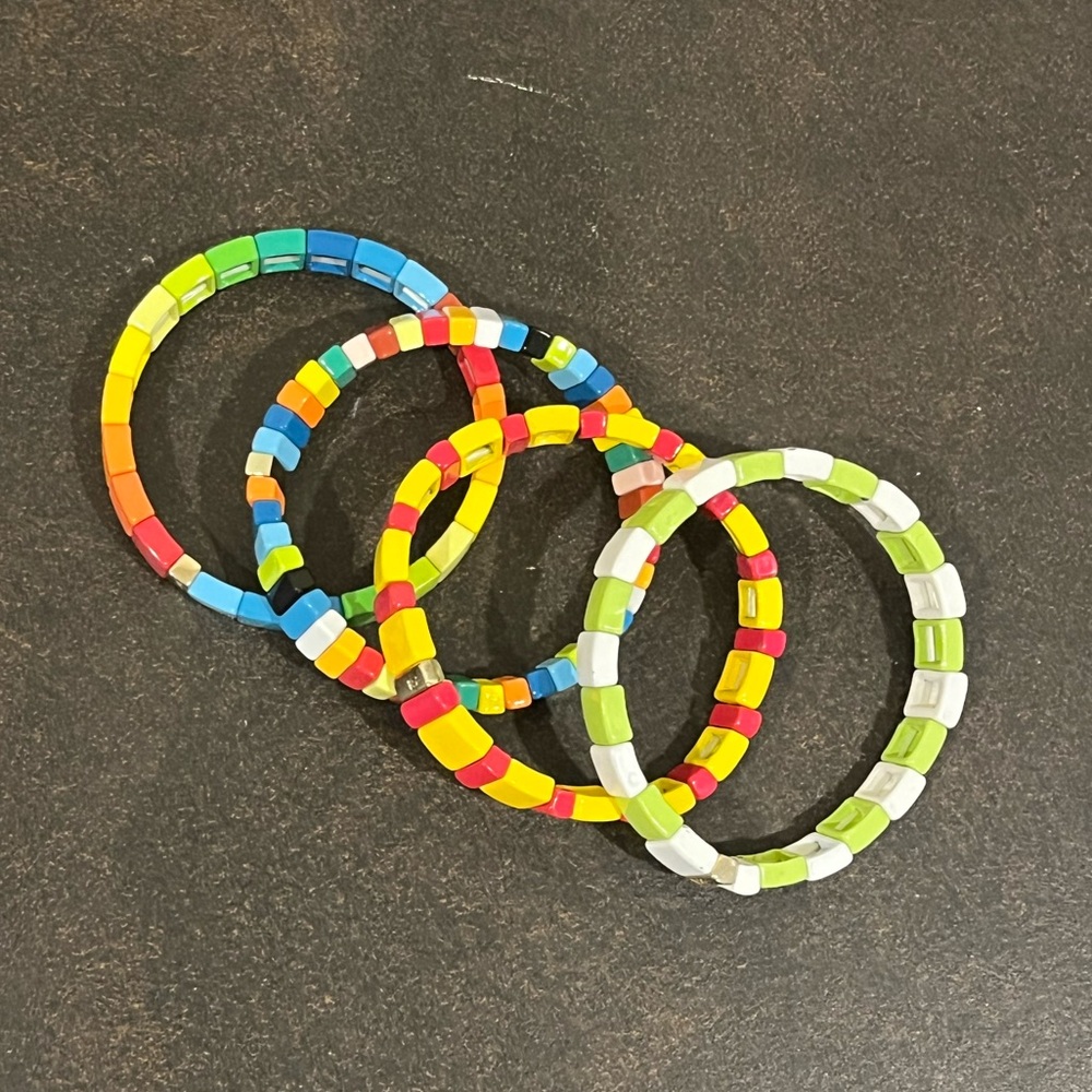 group of 4 Roxanne Assoulin bracelets